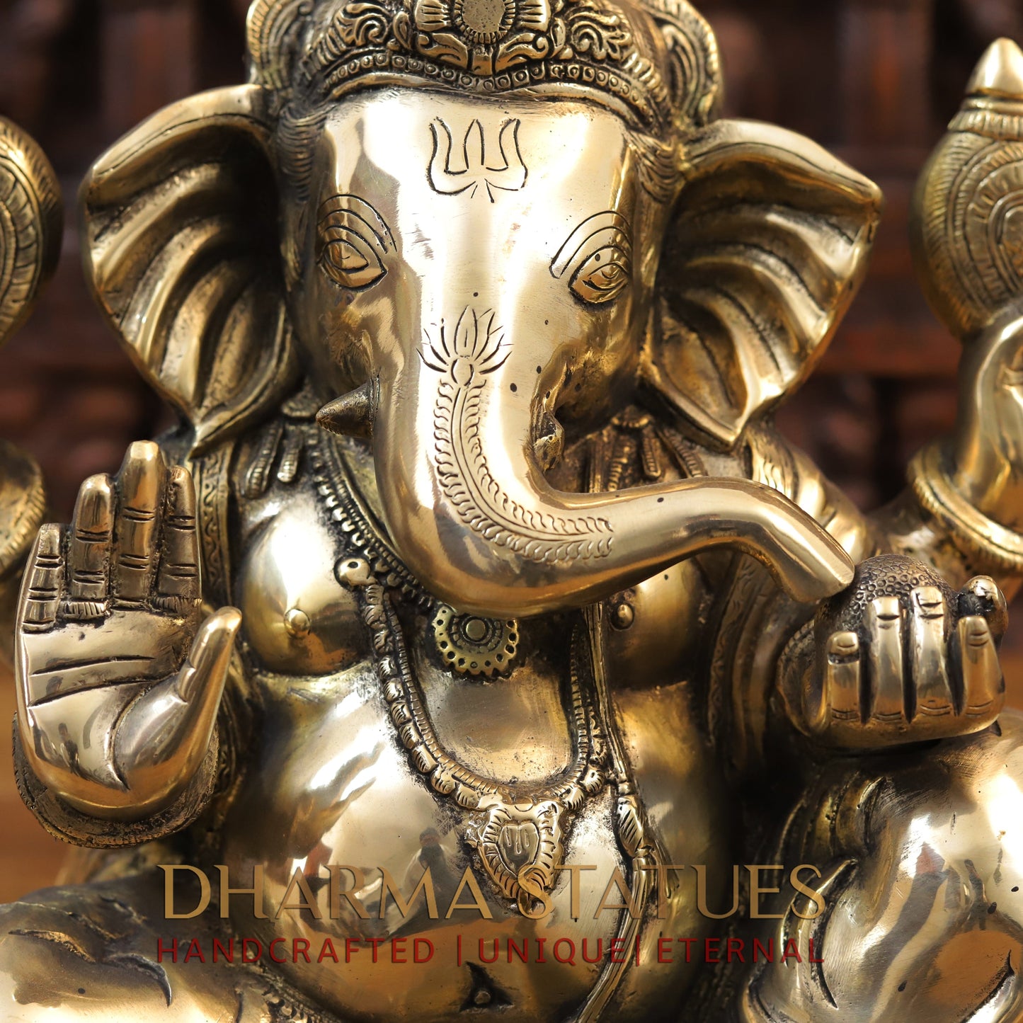 Brass Ganesh seated with tilted neck, Golden Finish, 13.5"