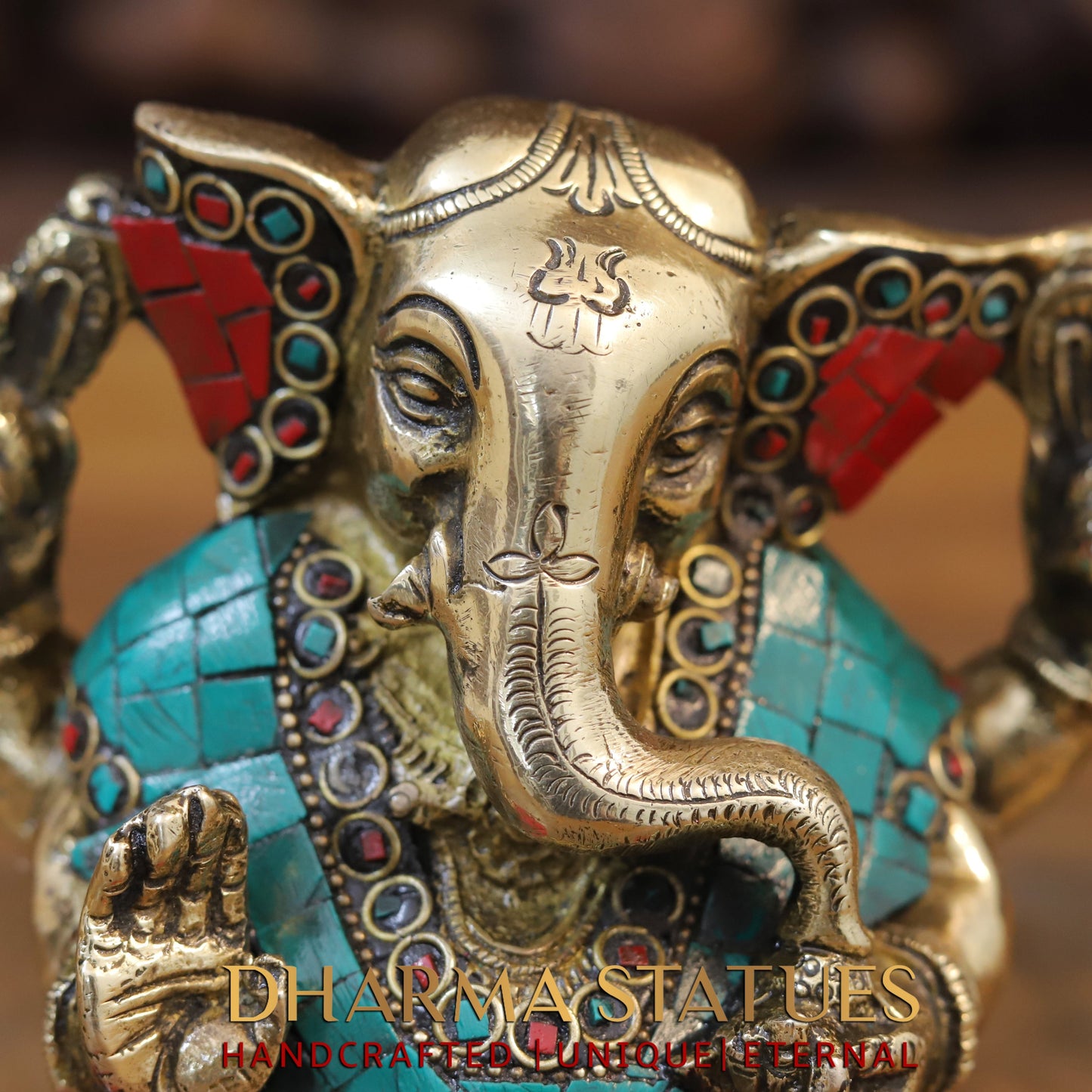 Brass Ganesh seated with tilted neck, Stone work, 5.5”