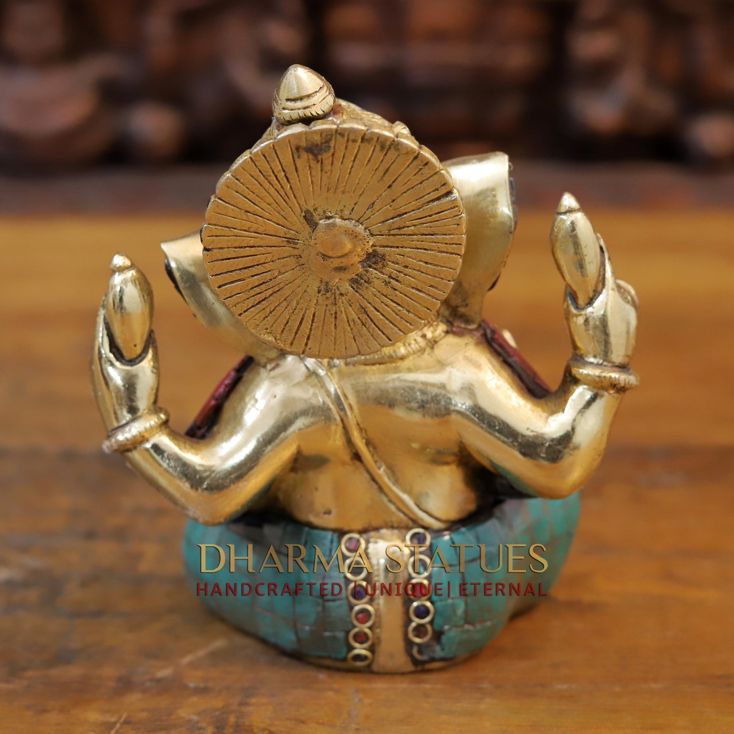 Brass Ganesh seated with tilted neck, Golden & Stone work, 7"